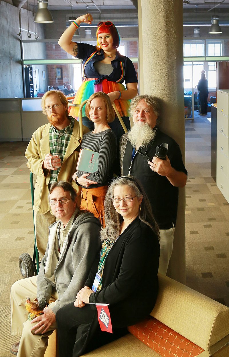 Encyclopedia of Arkansas staff are (clockwise from top) Jasmine Jobe, Michael Keckhaver, Nathania Sawyer, Mike Polston, Guy Lancaster and (center) Ali Welky. 