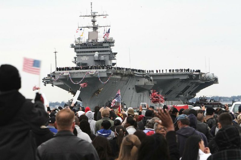 The USS Enterprise returns to Norfolk Naval Station in Norfolk, Va., on Sunday as the 51-year-old ship completes its 25th and final deployment. 