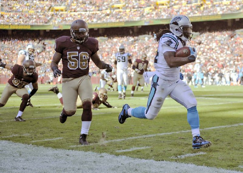 Carolina Panthers running back DeAngelo Williams (right) of Wynne wasn’t happy that the Washington Redskins held a “homecoming” celebration during Sunday’s game in Washington, D.C. 