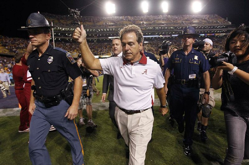 Alabama Coach Nick Saban walks off the field after the Crimson Tide came from behind to beat LSU 21-17 Saturday night to preserve their No. 1 ranking in the BCS. 