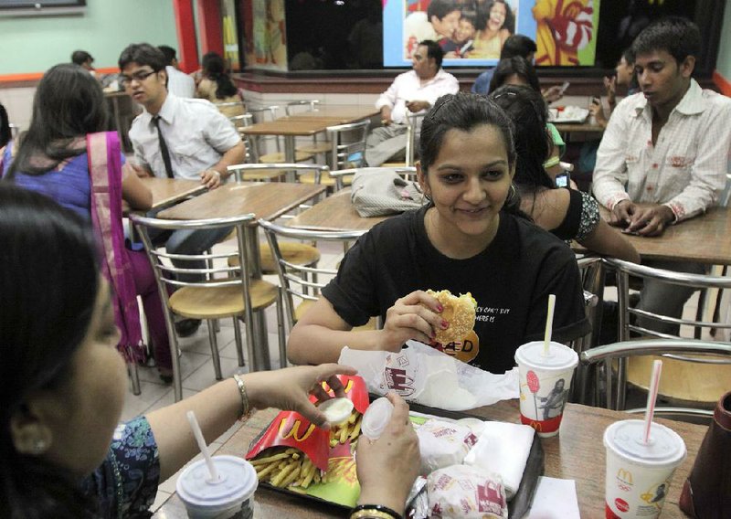 Patrons eat at a McDonald’s restaurant in Noida, India, near New Delhi. 