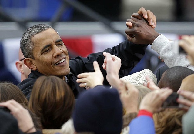 President Barack Obama greets supporters Monday after speaking at a campaign event near the state Capitol in Madison, Wis.