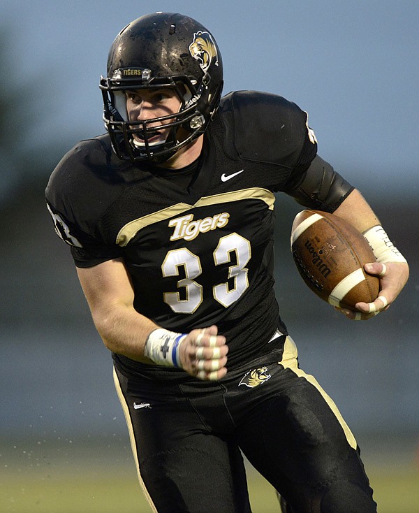 Garrett Kaufman of Bentonville rushed for 40 yards and a touchdown and threw a 38-yard touchdown pass. On defense, he had nine solo tackles, including a sack, broke up a pass, forced the fumble that led to the go-ahead touchdown pass for the Tigers, and intercepted a pass. 