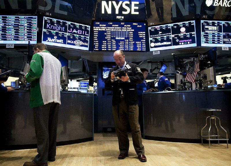 Traders work on the floor of the New York Stock Exchange on Tuesday. 