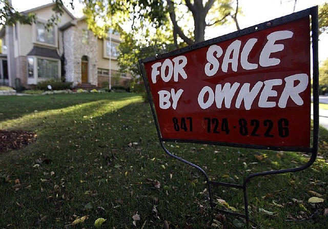 A sale sign marks a house in Glenview, Ill., in early October. Prices for single-family homes rose 5 percent in September, compared to the same month a year ago, according to data analyst CoreLogic. 