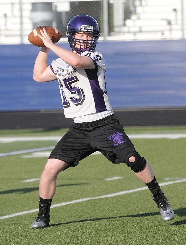 Mitchell Clark, Elkins’ quarterback and son of coach Aaron Clark, admits it is tough to be the coach’s son but also believes it has helped him learn more about the game. 