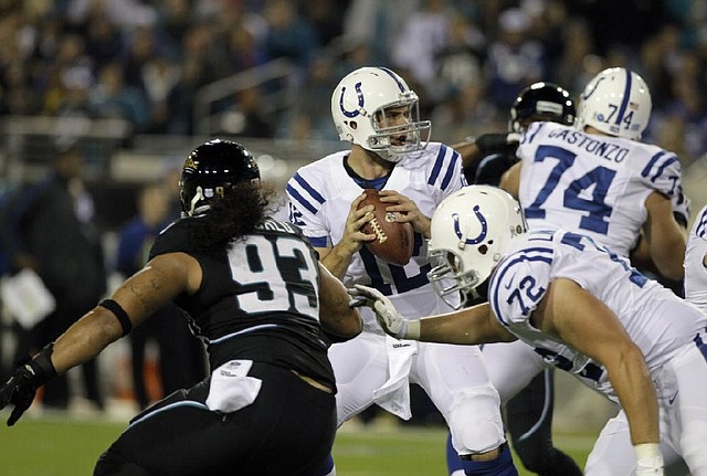 Indianapolis Colts quarterback Andrew Luck (center) completed 18 of 26 passes for 227 yards and rushed for 2 second-quarter touchdowns in Thursday’s game against the Jacksonville Jaguars in Jacksonville, Fla. Luck also threw an interception that was returned for a touchdown. 