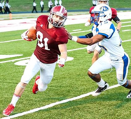 Henderson State wide receiver Dustin Holland is one of four Reddies receivers who are older than 22 and have taken unorthodox paths to college football. He also is married with five children. 
