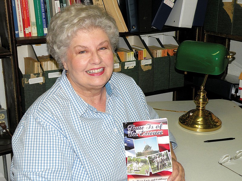 Vivian Lawson Hogue, editor of Faulkner Facts and Fiddlings, holds a copy of a special edition of the journal, “Time Is of the Essence,” which is on sale at the Faulkner County Museum and the Faulkner County Library in Conway. The edition is dedicated to veterans and features war stories told by veterans or their family members.