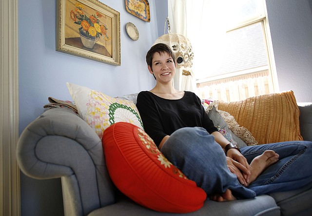 Vanessa Ryerse sits in her favorite personal space, the corner of her bedroom in her Springdale home.