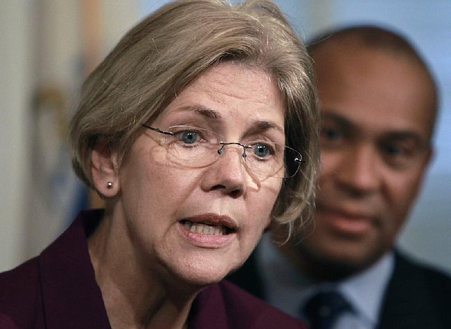 U.S. Sen.-elect Elizabeth Warren, D-Mass. (left) faces reporters as Mass. Gov. Deval Patrick (right) looks on during a news conference Thursday. 