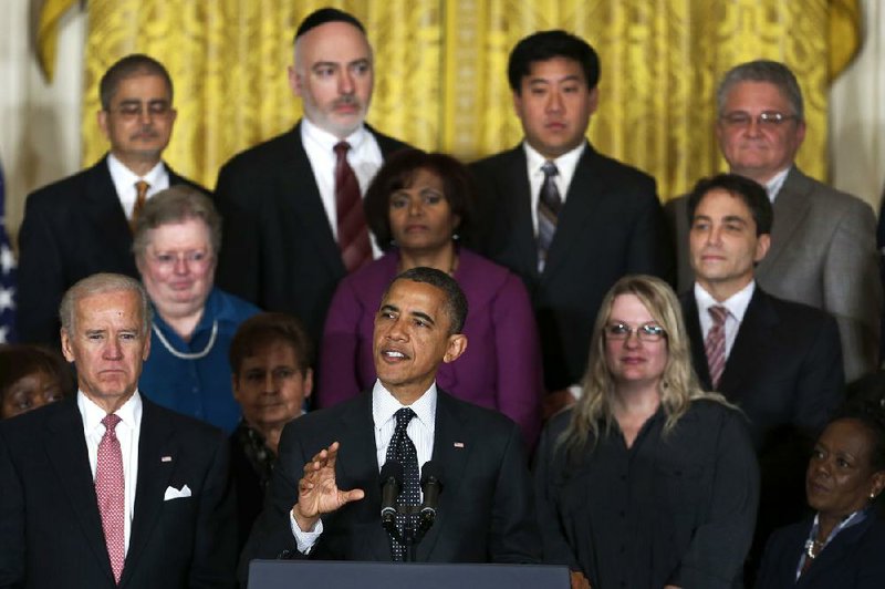 President Barack Obama, joined Friday at the White House by Vice President Joe Biden (left) and a group of supporters, declared, “I’m open to compromise. I’m open to new ideas. I’m committed to solving our fiscal challenges. But I refuse to accept any approach that isn’t balanced.” 