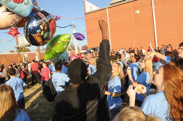 Southwest Junior High School students release balloons Friday in honor of Cameron Wickham, an eighth-grader, after the Make a Wish Foundation granted his wish to go to Disney World during a school assembly. The National Junior Honor Society at Southwest led a fundraising campaign last year to help make Cameron’s wish come true and collected more than $5,000 to help send him and his family to the theme park. 
