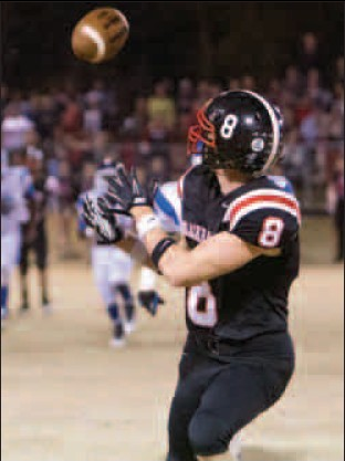 Daniel Beard of Pea Ridge eyes a catch Friday on a more than 50-yard throw for a touchdown during the first quarter against Monticello at Blackhawk Stadiumn in Pea Ridge. 