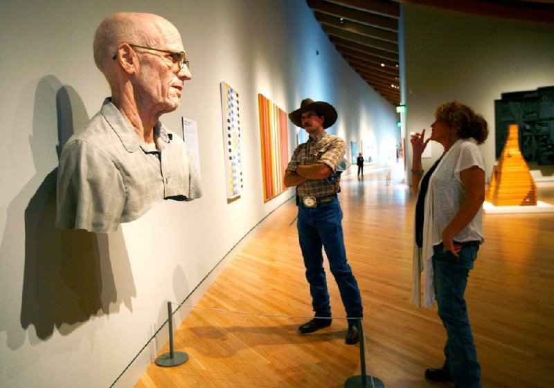 Mark and Missy Yount of Bentonville view Evan Penny’s Old Self: Portrait of the Artist as He Will (Not) Be. Variation No. 2 at Crystal Bridges Museum of American Art in Bentonville in late October. Roughly 70 percent of the museum’s 600,000 visitors in the first year were from Arkansas. 
