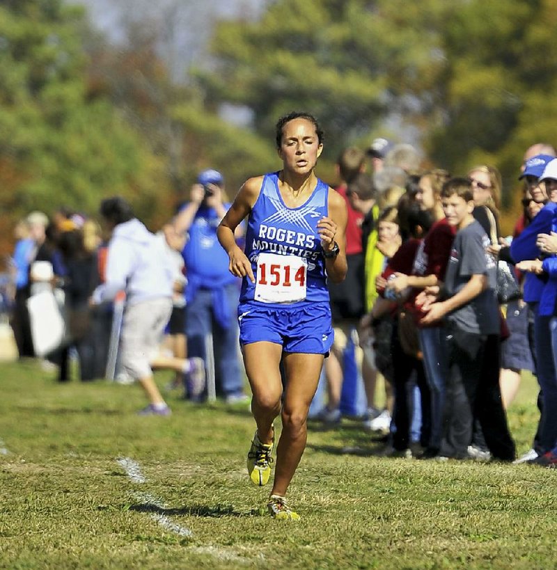 Maggie Montoya of Rogers defended her individual title when she won the Class 7A girls state cross country meet with a time of 18 minutes, 17.7 seconds Saturday at Oaklawn Park in Hot Springs. 