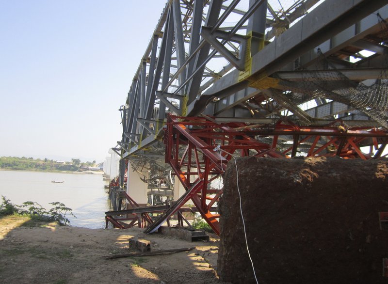 Structures of a bridge under construction across the Irrawaddy River, east of Shwebo, Myanmar are seen damaged after a strong earthquake on Sunday, Nov. 11, 2012. The magnitude-6.8 quake struck northern Myanmar on Sunday, collapsing the bridge and a gold mine, damaging several old Buddhist pagodas and leaving as many as 12 people feared dead. The bridge links the town of Sintku, 40 miles north of Mandalay on the east bank of the Irrwaddy with Kyaukmyaung on the west bank.