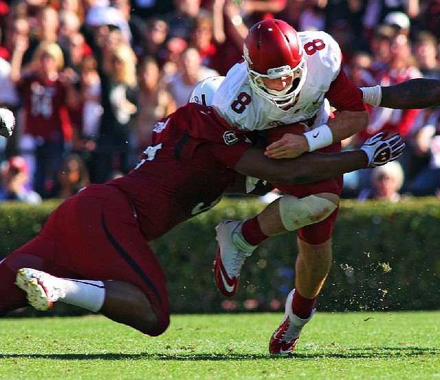 Arkansas football Coach John L. Smith says senior quarterback Tyler Wilson has earned the right to stay in games as long as he wants. 