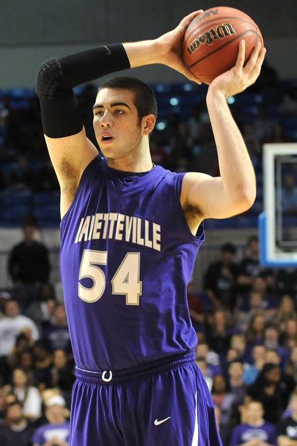 Tyler McCullough, Fayetteville, looks for an open teammate March 9 at Summit Arena in Hot Springs during the 7A boys state championship game against Little Rock Hall. Hall beat Fayetteville 42-31. 