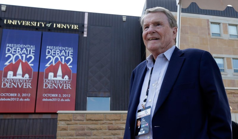 Jim Lehrer walks outside the Magness Arena at the Daniel L. Ritchie Center for Sports and Wellness, site of the first 2012 presidential debate, on the campus of the University of Denver, Monday, Oct. 1, 2012, in Denver. Lehrer is the debate moderator.