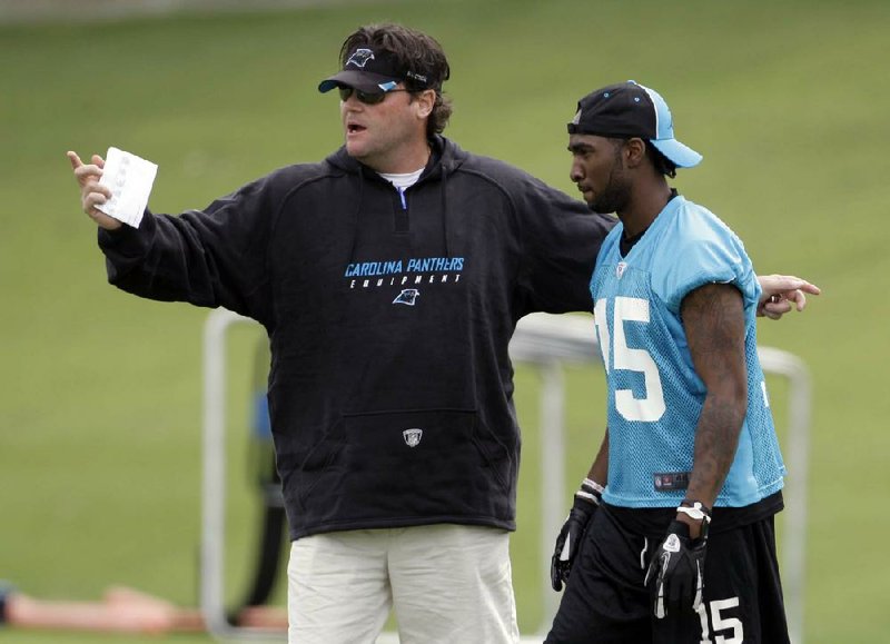 Carolina Panthers special teams coordinator Brian Murphy (left), working with receiver Joe Adams (Arkansas) during a preseason minicamp, was fired by Panthers Coach Ron Rivera on Monday after the team gave up a 76-yard punt return for a touchdown to Trindon Holliday in Sunday’s 36-14 loss to the Denver Broncos. 