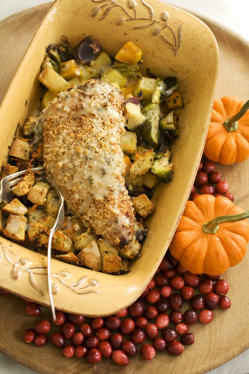 A cozy Thanksgiving dinner for two featuring turkey tenderloin, gravy, roasted vegetables and dressing can be baked in one pan without skimping on traditional fare. 