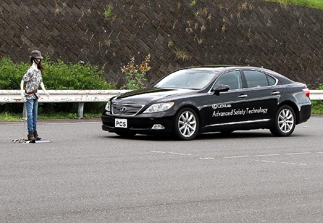 A Lexus sedan stops short of hitting a dummy during a demonstration of a braking safety feature at a Toyota Motor Corp. testing facility in Sunsono, Japan, in 2011. 