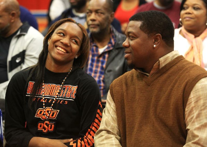 Roshunda Johnson (left) talks with her father Edward Johnson on Wednesday afternoon at Parkview High School before signing to play basketball at Oklahoma State University. 