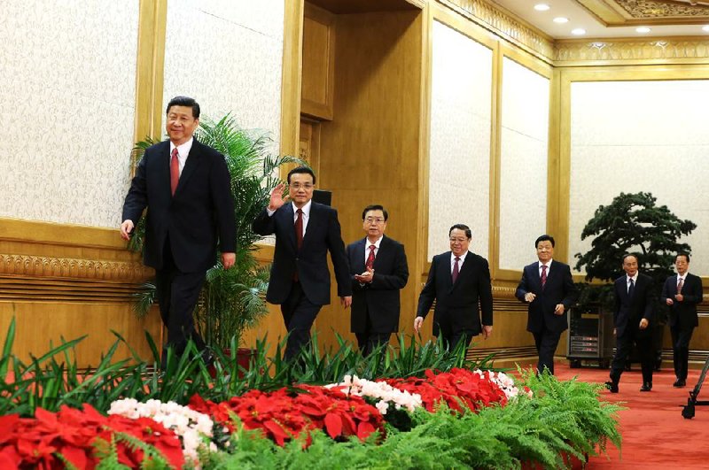 New Chinese Communist Party General Secretary Xi Jinping leads a procession of the party’s new politburo standing committee at the Great Hall of the People in Beijing. 