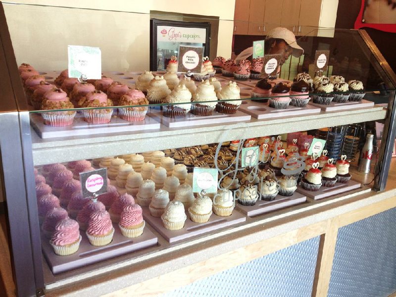 Cupcakes are tempting in display cases at Gigi’s Cupcakes. 