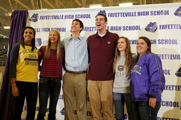 Several Fayetteville High athletes signed letters of intent Wednesday to play their respective sports for colleges at a signing ceremony at Bulldog Gymnasium in Fayetteville. The athletes are, from left, Vanessa Matlock, signed with Oral Roberts for basketball; Aubrey Edie, signed with Ole Miss for volleyball; Caleb Waitsman, signed with Colorado School of Mines for basketball; Tyler McCullough, signed with Missouri State for basketball; Tatum Marshall, signed with Missouri State for volleyball; and Ashlye Pool, signed with Crowder College for softball. 