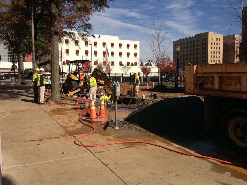 Crews work Thursday, Nov. 15, 2012, to repair a broken water main at Louisiana and Third streets in downtown Little Rock.
