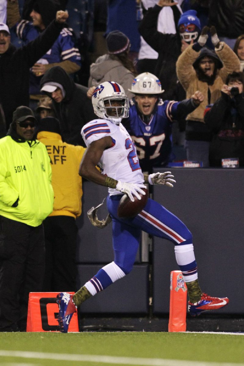 Buffalo Bills cornerback Leodis McKelvin (21) scores on a 79-yard punt return 90 seconds into the first quarter of Thursday’s game against the Miami Dolphins in Orchard Park, N.Y. The Bills never trailed and won 19-14. 