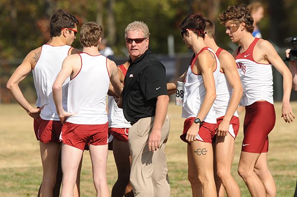 Arkansas Coach Chris Bucknam (center) and the Razorbacks are ranked 11th nationally heading into Saturday’s race. 