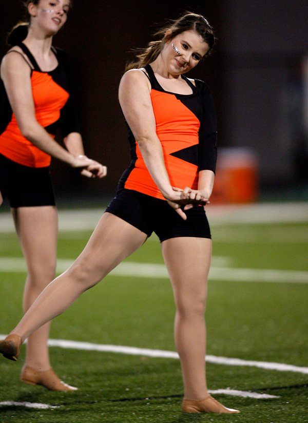 Arianna Phillips, Rogers Heritage senior, performs with the dance team Oct. 19 before the War Eagles’ game at Gates Stadium in Rogers. 