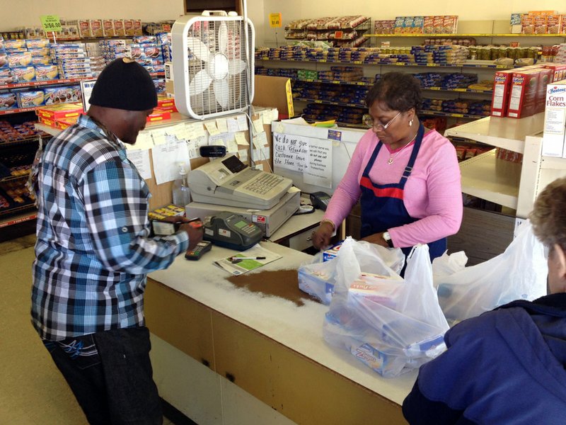 Lue Kelley, a clerk at the Hostess outlet in Little Rock, checks out a customer Friday morning.