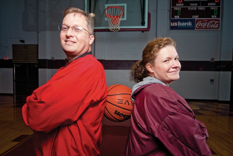 Siblings Craig Pinion, left, and Carin Pinion-McNabb will be coaching against each other for the first time when Craig’s Atkins and Carin’s Morritlon girls basketball teams face off Tuesday night, just before the pair will be at their parents’ home in Atkins for the Thanksgiving holiday.