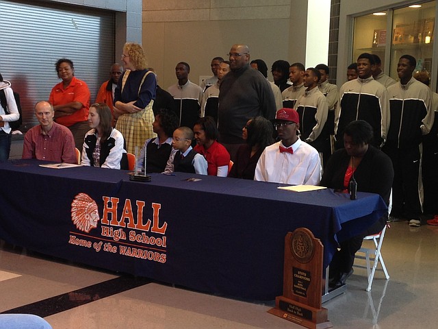 Hall center Bobby Portis (right), along with Lady Warriors Tyler Scaife (center) and Katelyn Weber all signed with colleges at a ceremony on Friday afternoon at Cirks Arena.