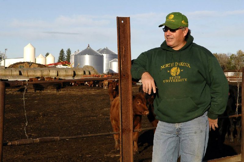 Farmer Doyle Johannes, who supports North Dakota’s new constitutional amendment aimed at protecting the right to farm and ranch, stands next to his cattle feedlot on his farm in Underwood, N.D. 