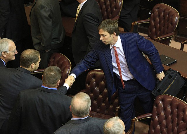 State Rep. Davy Carter is greeted by fellow legislators at the Capitol on Thursday after being elected to serve as the next speaker of the state House of Representatives. Republicans gained control of the House and the Senate for the first time since Reconstruction. 