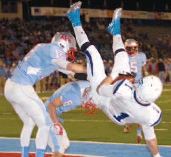 Nick Byrne, right, of Springdale Har-Ber comes down with the first touchdown pass of the game during Friday’s game against Fort Smith Southside at Fort Smith. 