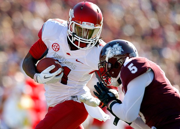 NWA Media/JASON IVESTER -- Arkansas senior wide receiver Cobi Hamilton is hit by Mississippi State junior Nicoe Whitley after making a touchdown catch during the first quarter on Saturday, Nov. 17, 2012, at Davis Wade Stadium in Starkville, Miss.