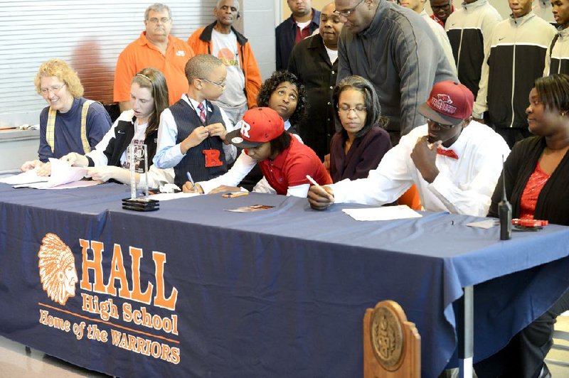 Kate Weber (second from left), Tyler Scaife (center) and Bobby Portis (second from right) all signed national letters of intent to play college basketball Friday. Portis signed with Arkansas while Scaife signed with Rutgers and Weber with Missouri State. 