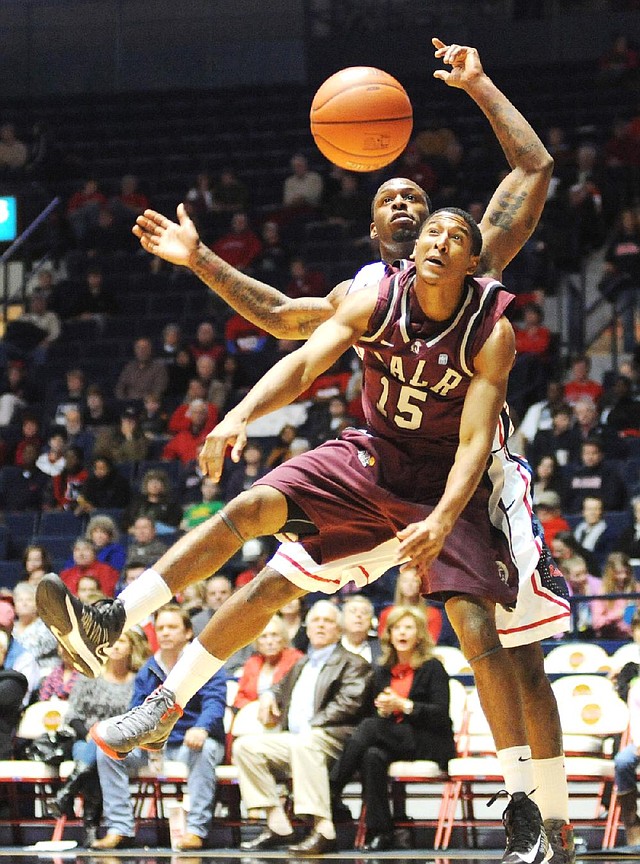 UALR’s Stetson Billings and Mississippi’s Murphy Holloway go for the ball during Friday night’s game in Oxford, Miss. 