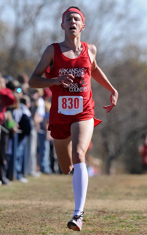 Grant Williams, a cross-country all-star representing the state of Arkansas, finishes first Saturday at Rogers High during the Arkansas-Oklahoma All-Star Cross Country Challenge. Williams won the race with a time of 16:11.36. 