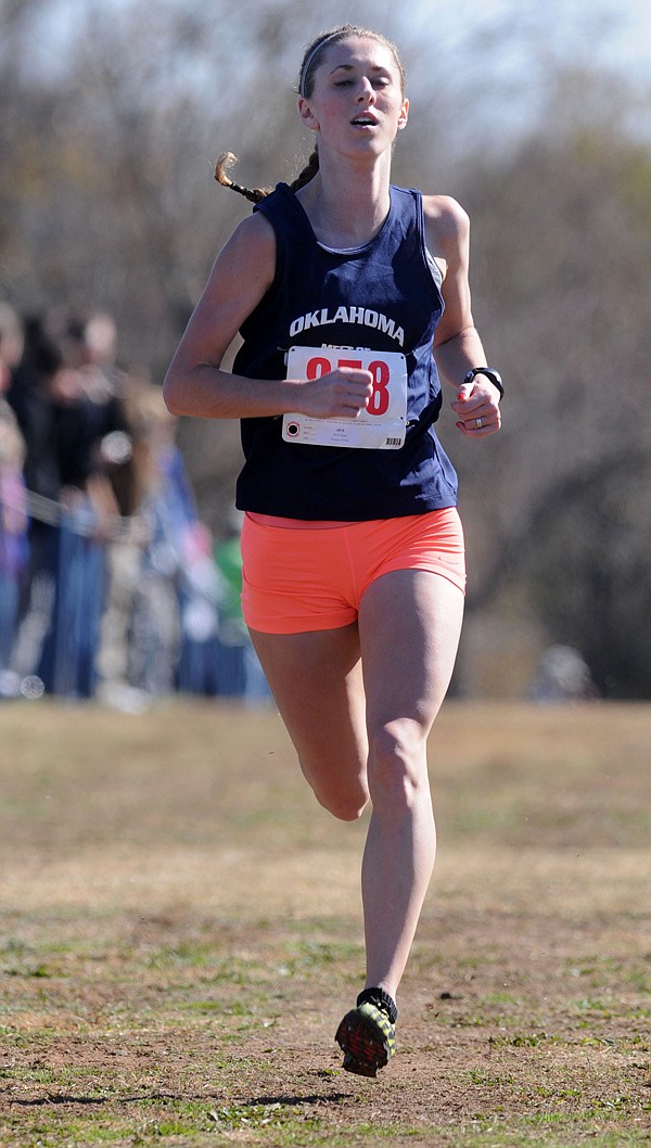 Regan Ward, a cross-country all-star representing the state of Oklahoma, is the first to finish Saturday at Rogers High during the Arkansas-Oklahoma All-Star Cross Country Challenge. Ward won the race with a time of 18:17.70.