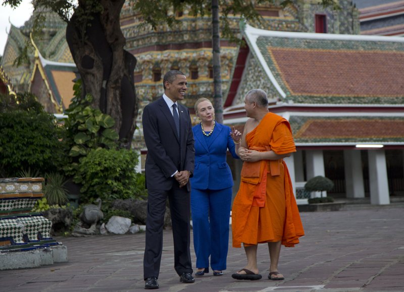 U.S. President Barack Obama, left, and U.S. Secretary of State Hillary Rodham Clinton, center, tour the Wat Pho Royal Monastery with Chaokun Suthee Thammanuwat, Dean, Faculty of Buddhism Assistant to the Abbot of Wat Phra Chetuphon, in Bangkok, Thailand, Sunday, Nov. 18, 2012.