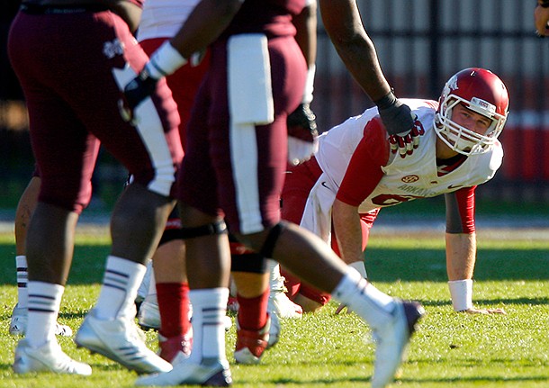 NWA Media/JASON IVESTER -- Arkansas senior quarterback Tyler Wilson gets up from the field after being sacked by the Mississippi State defense during the fourth quarter on Saturday, Nov. 17, 2012, at Davis Wade Stadium in Starkville, Miss.