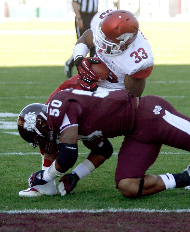 Dennis Johnson caught a pass a 7-yard touchdown pass from Tyler Wilson, getting past Benardrick McKinney to give Arkansas a 14-7 lead. 