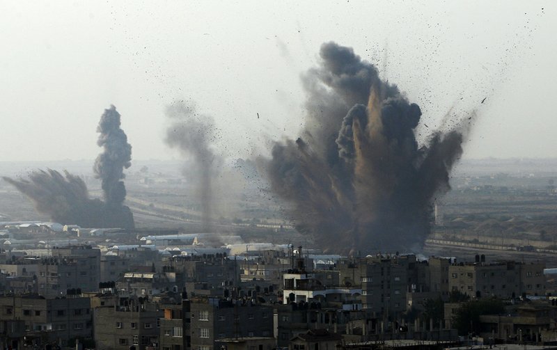 Smoke rises after an Israeli attack on smuggling tunnels on the border between Egypt and Rafah, southern Gaza Strip, on Monday, Nov. 19, 2012. 